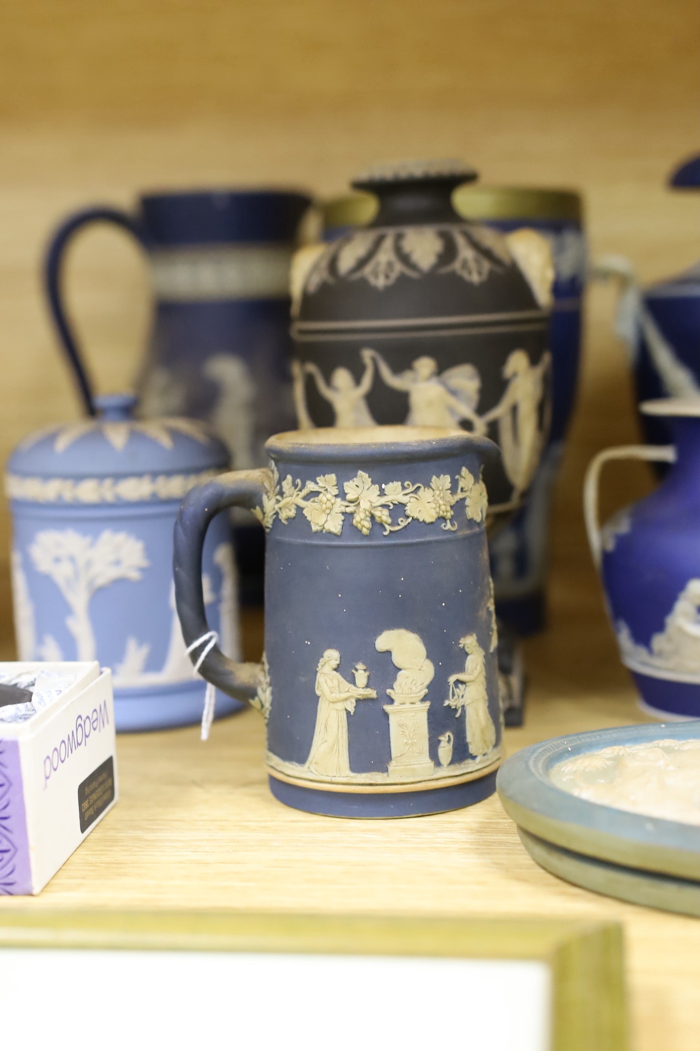 A collection of Victorian and later Jasperware, including a 19th century Wedgwood version of the Portland vase, 23 cms high